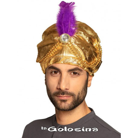 Turbante dorado con pluma